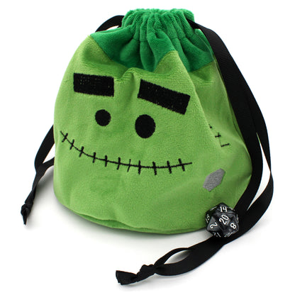 Each Trick or Treat Mystery Bag contains a selection of spooky delights, including 3 full sets of dice, as well as an assortment of goodies, all held in a plush Franken-pouch.