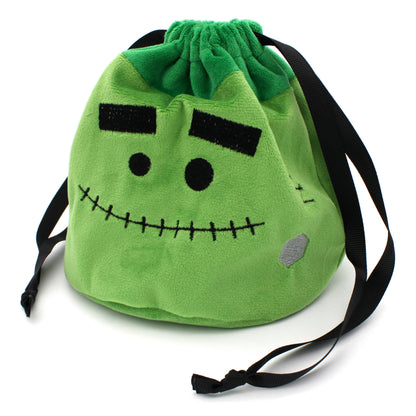 Each Trick or Treat Mystery Bag contains a selection of spooky delights, including 3 full sets of dice, as well as an assortment of goodies, all held in a plush Franken-pouch.