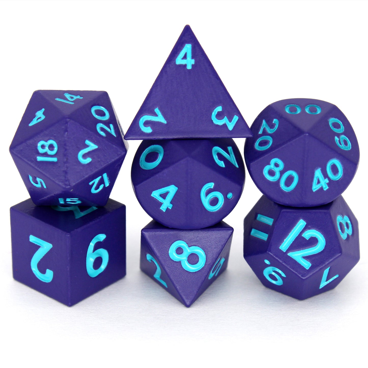 Tricksters is a 7-piece set of matte, purple colored 10mm metal dice with bright blue inking.