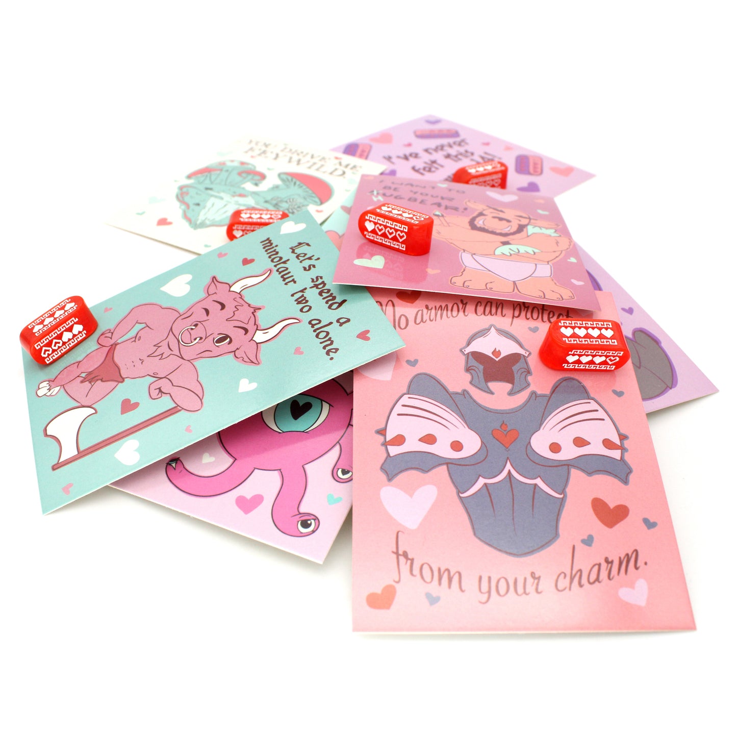 Each box of Valentines contains nine tabletop-themed cards, nine red Infinity d4s with our Pixel Heart design in white ink, as well as nine adhesives to affix the dice to the cards, all held in a pink printed package.