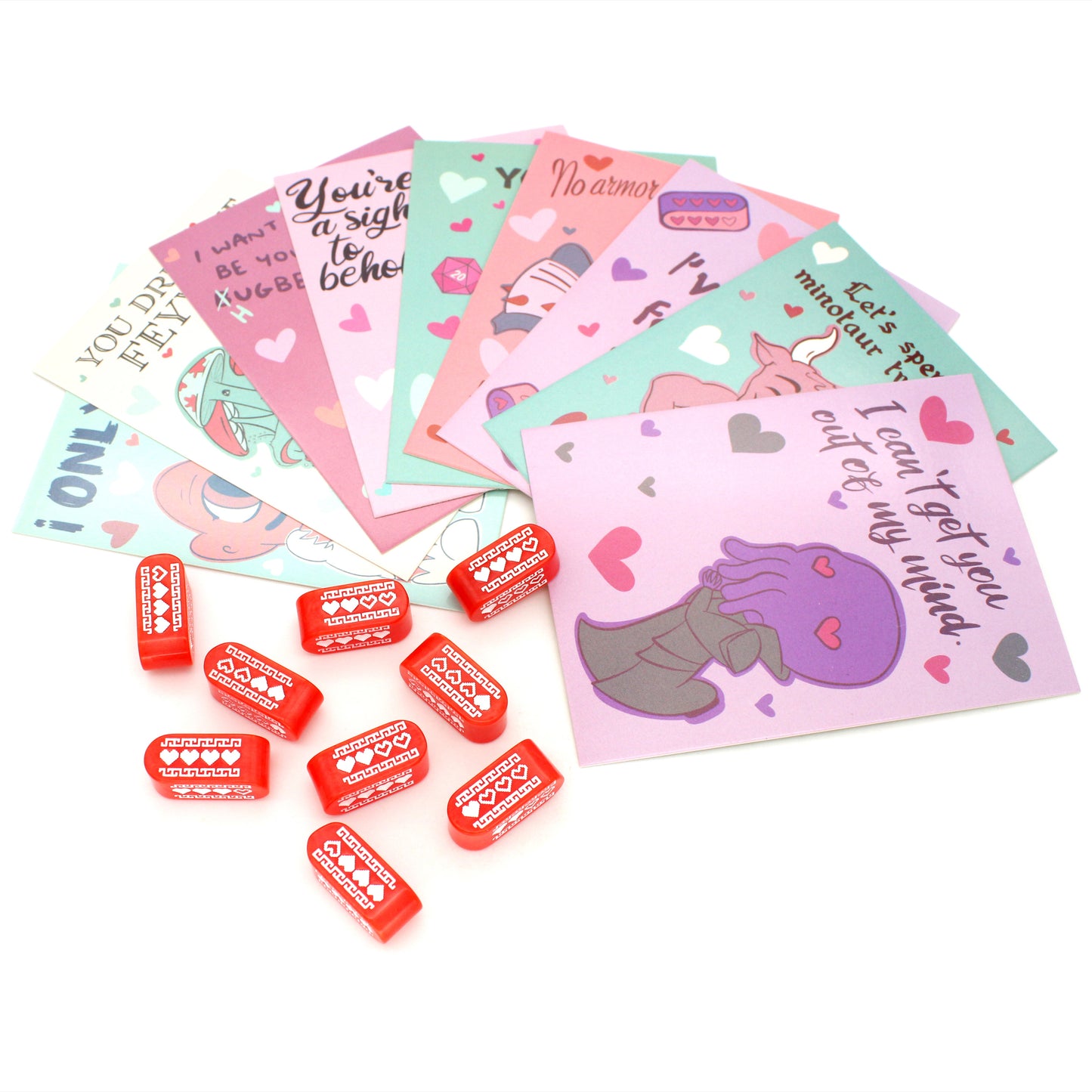 Each box of Valentines contains nine tabletop-themed cards, nine red Infinity d4s with our Pixel Heart design in white ink, as well as nine adhesives to affix the dice to the cards, all held in a pink printed package.