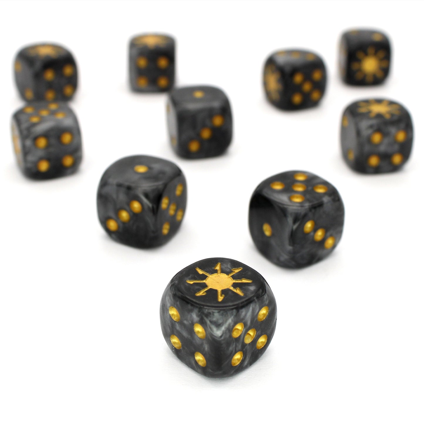 War Chaos (Dark) is a 10-piece set of 16mm polymer d6s in heavy metal blacks, with pips and burst engraving in gold ink. It is part of our Fantasy Squads series of dice for miniature wargaming.