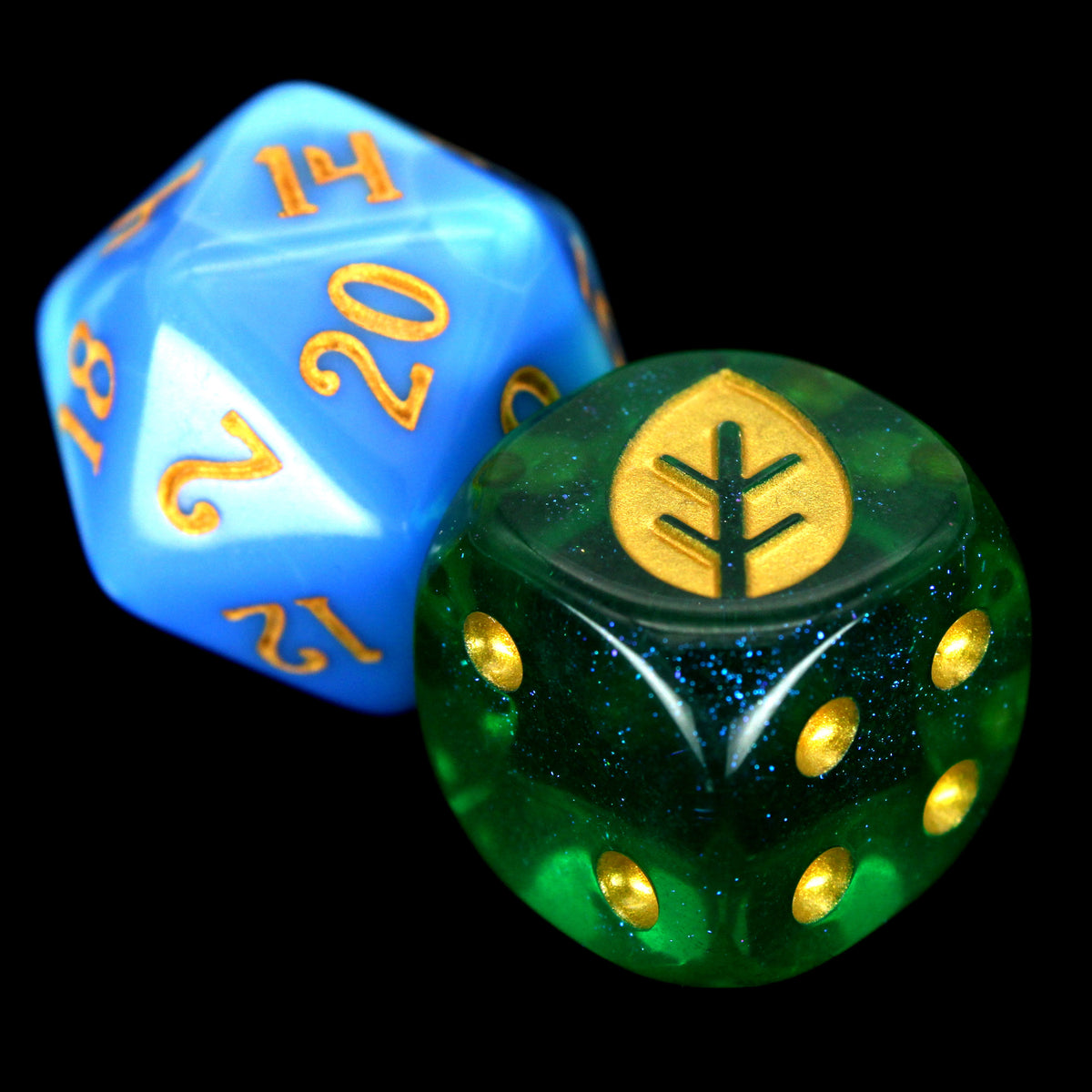 War Growth (Kelp) is a 10-piece set of 16mm acrylic d6s in transparent green, filled with glistening blue glitter, with pips and leaf engraving in gold ink.