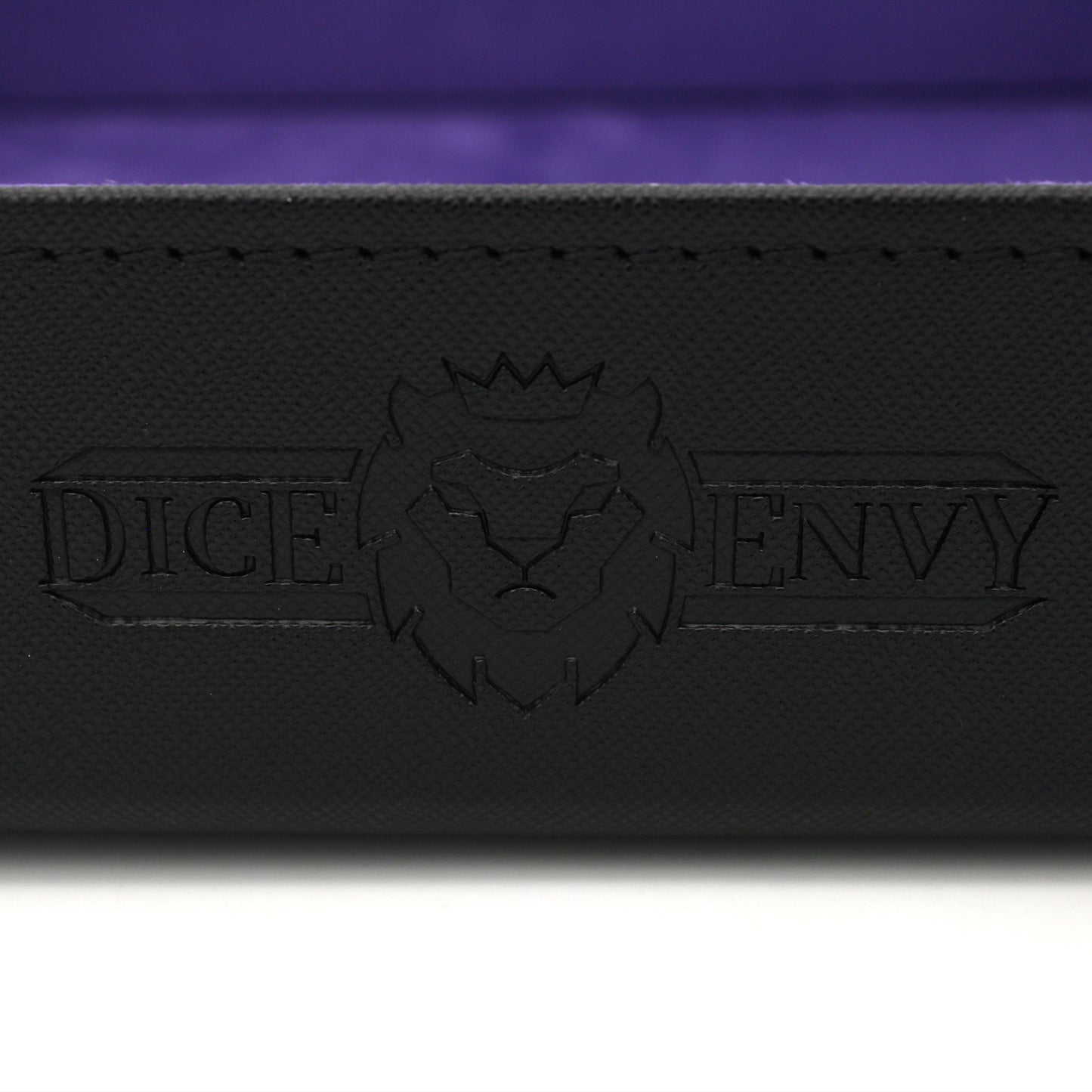 Made of vegan leather and microsuede, our dice trays have hidden magnets that hold them together and are available in druid green, warlock purple, barbarian tan, cleric blue, rogue red, and necromancer black.