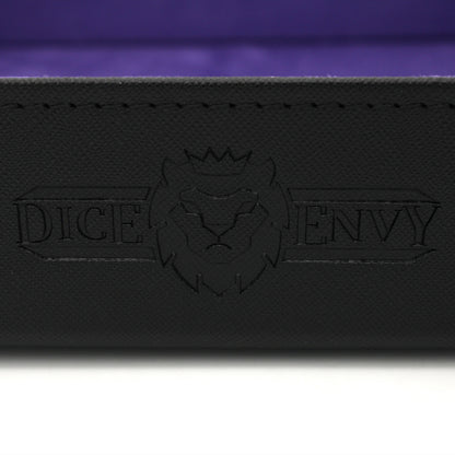 Made of vegan leather and microsuede, our dice trays have hidden magnets that hold them together and are available in druid green, warlock purple, barbarian tan, cleric blue, rogue red, and necromancer black.