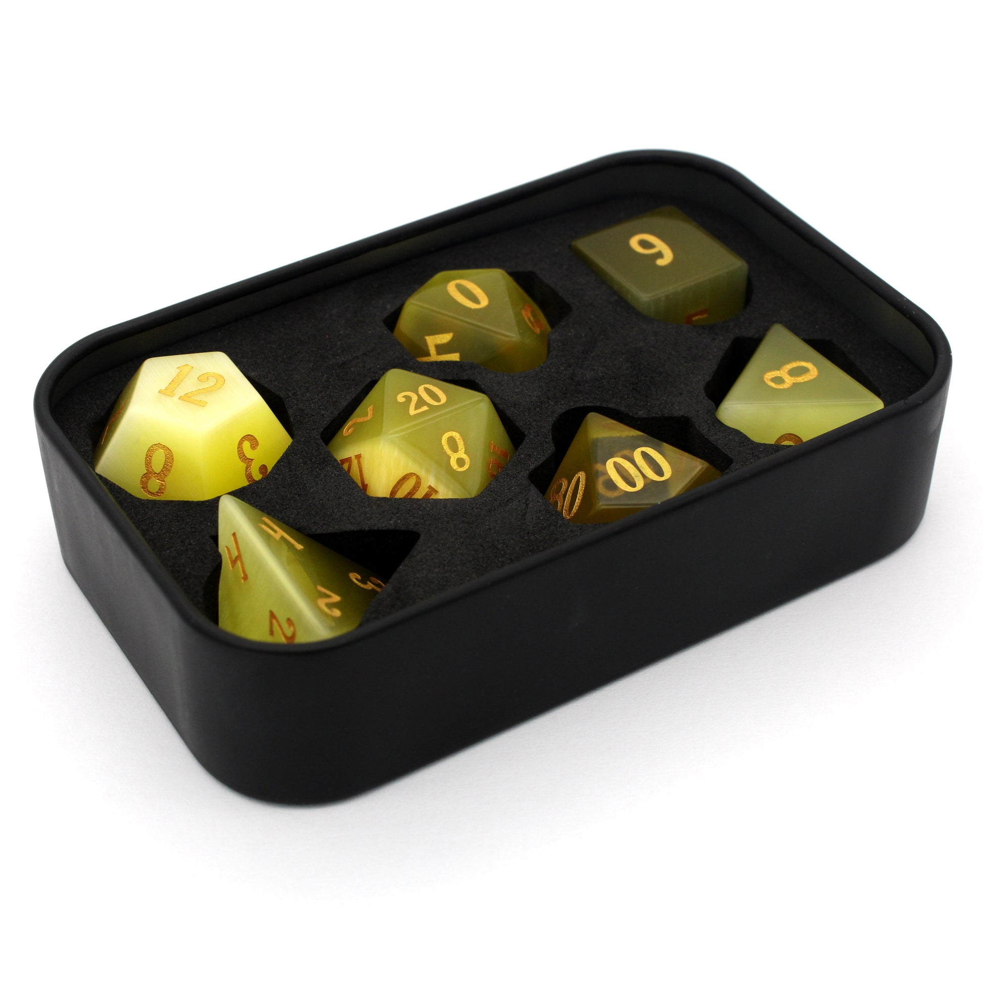 Werecat is a 7-piece set of yellow cat's eye crystal dice with gold numbering.