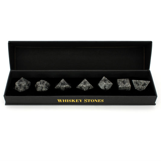 Whiskey Stones are a 7-piece soapstone set inked in black and coated with food-safe sealant. Place in the freezer for at least one hour, then use in a glass with whiskey (or beverage of your choice). Please do not eat/swallow the dice.