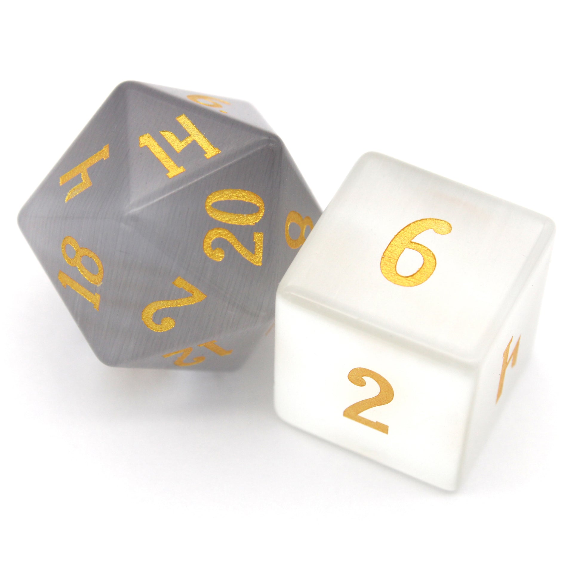 Winterfest is a 7-piece set of wintery white cat's eye crystal dice with gold numbering.