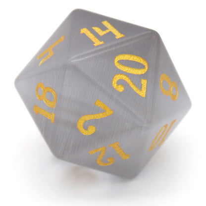 Winterfest is a 7-piece set of wintery white cat's eye crystal dice with gold numbering.
