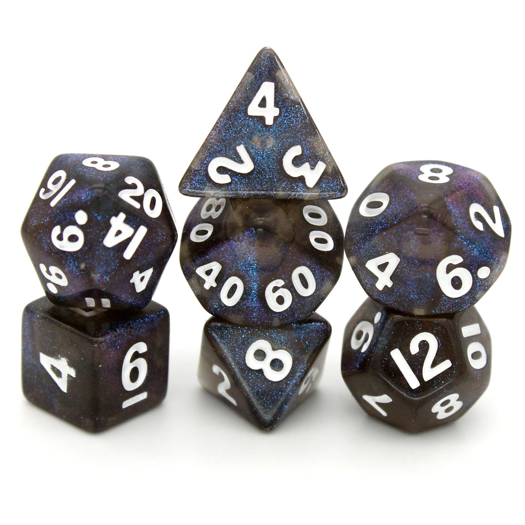 Witching Hour is a 7-piece, 13mm, dark grey resin dice set featuring color-shifting indigo-purple micro glitter, inked in white.
