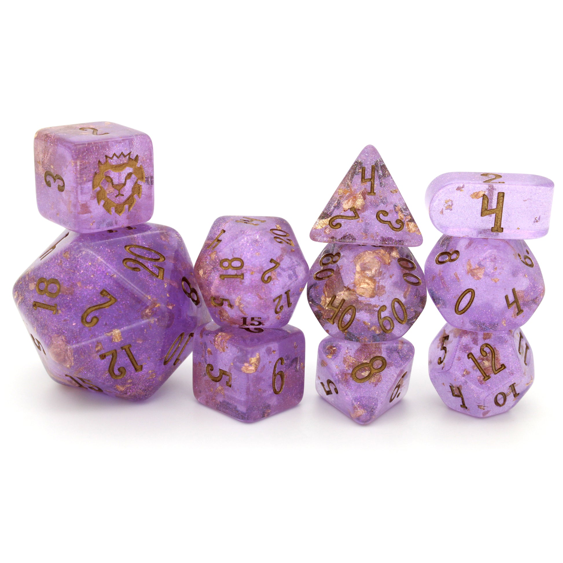 Wizard's Weave is a 10-piece set of translucent, glittery, purple resin dice sprinkled with gold foil and inked in bronze.