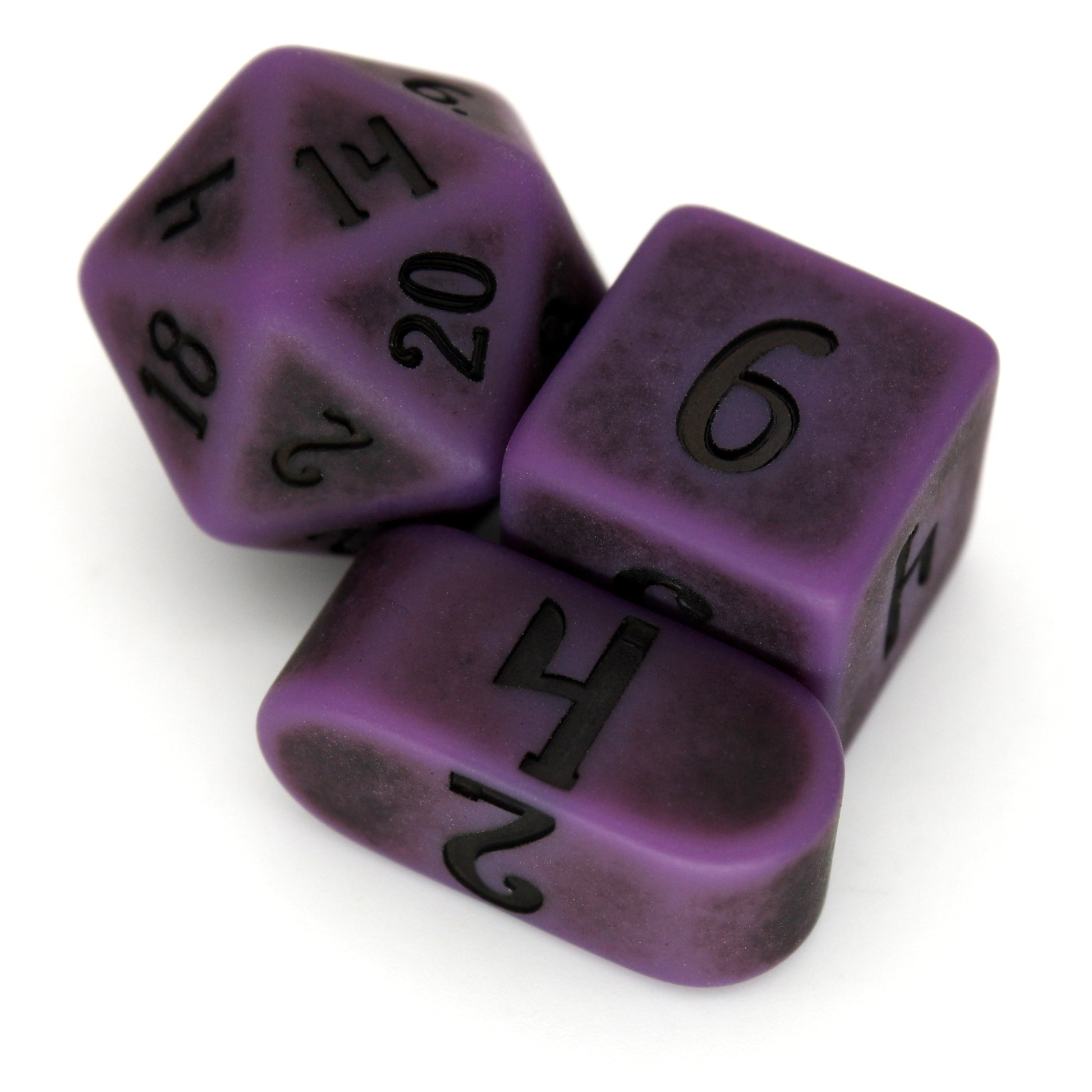 Worm Poison is a 10-piece set of wormy purple resin dice with a matte powder finish and black inking.