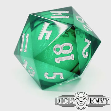 Siren Song Chonky is a translucent emerald-green, sharp edge resin 33m d20 with a liquid core of color-shifting pearlescent glitter, inked in silver.