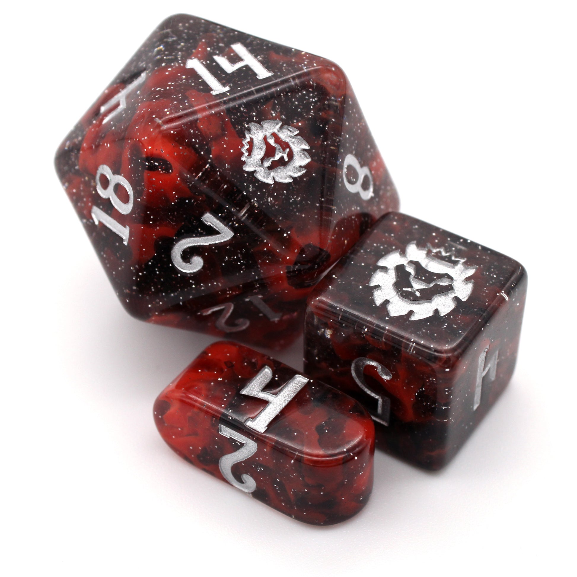 Carina Nebula is a marvel of astronomical beauty with swirls of opaque red and glittery translucent black resin that give amazing depth and unique patterning to each set of silver inked dice!