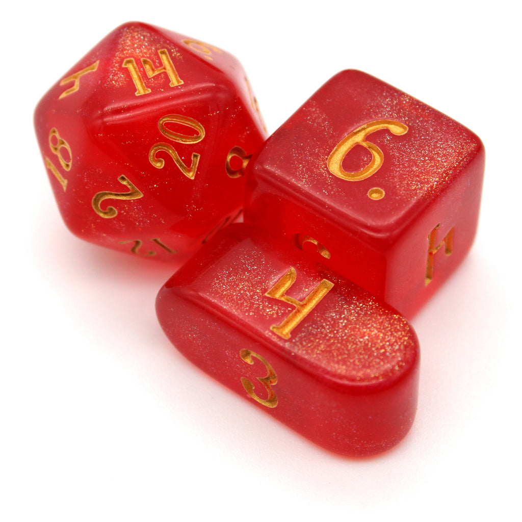 Carmine Kiss is a deep red 10-piece resin set with gold microglitter fill and gold inking to top it off.