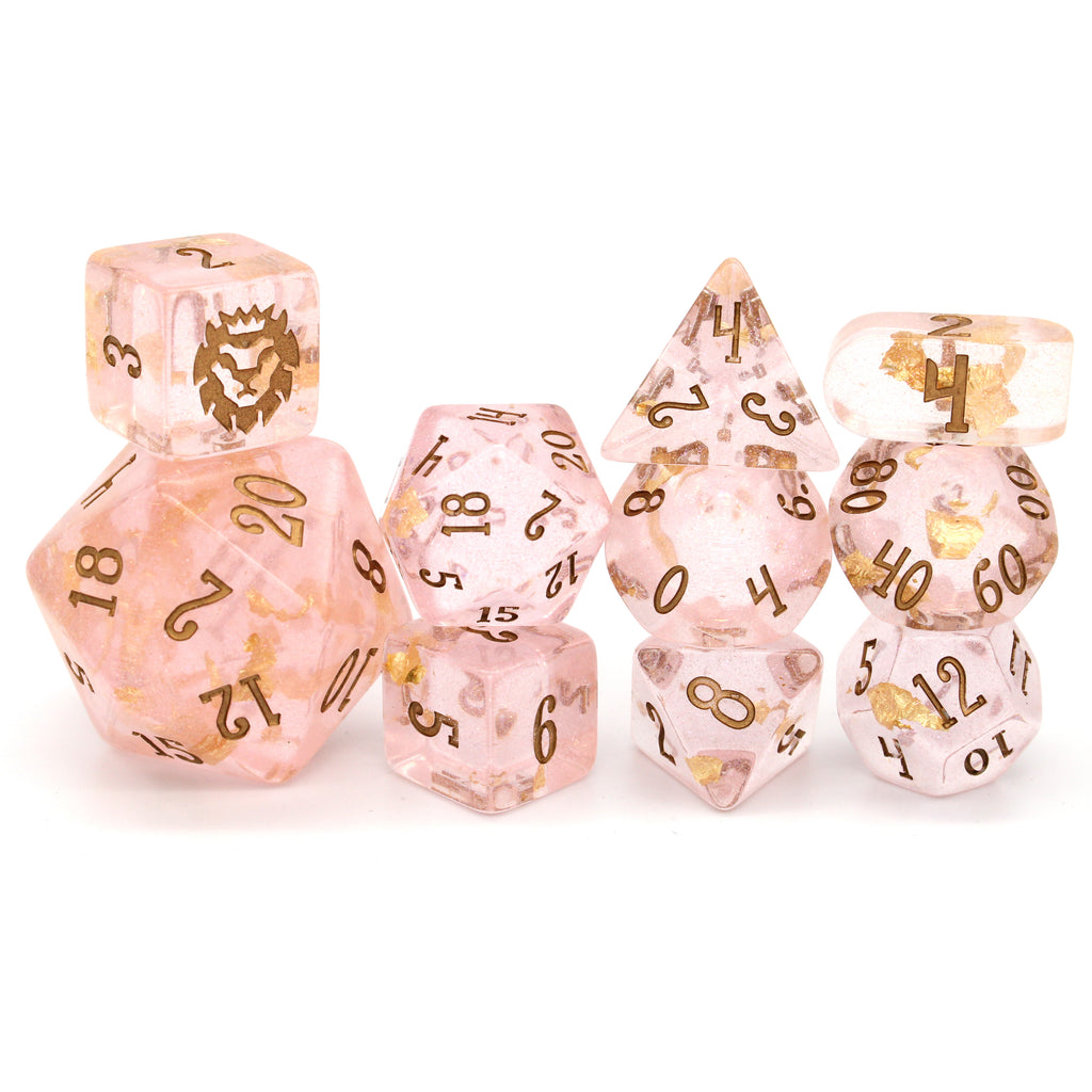 Celestain is a light pink 10-piece resin set with gold flake inclusions, gold micro glitter, and bronze ink.