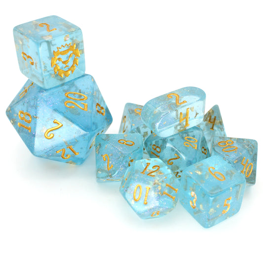 Celesteal is a bright blue 10-piece resin set with gold flake inclusions, pink micro glitter, and gold ink.