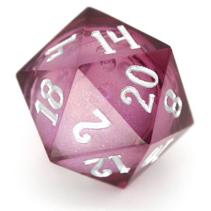 Dionysus's Delight is a 7-piece, translucent magenta, sharp edge resin dice set with a liquid core of color-shifting pearlescent glitter, inked in silver.