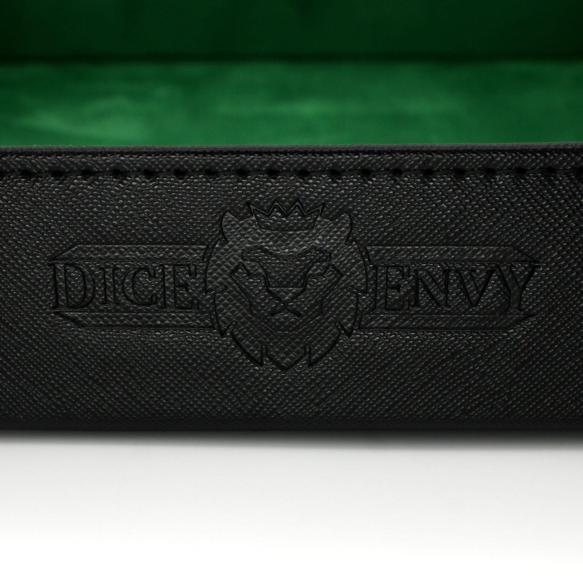 Made of vegan leather and microsuede, our dice trays have hidden magnets that hold them together and are available in druid green, warlock purple, barbarian tan, rogue red, and necromancer black.