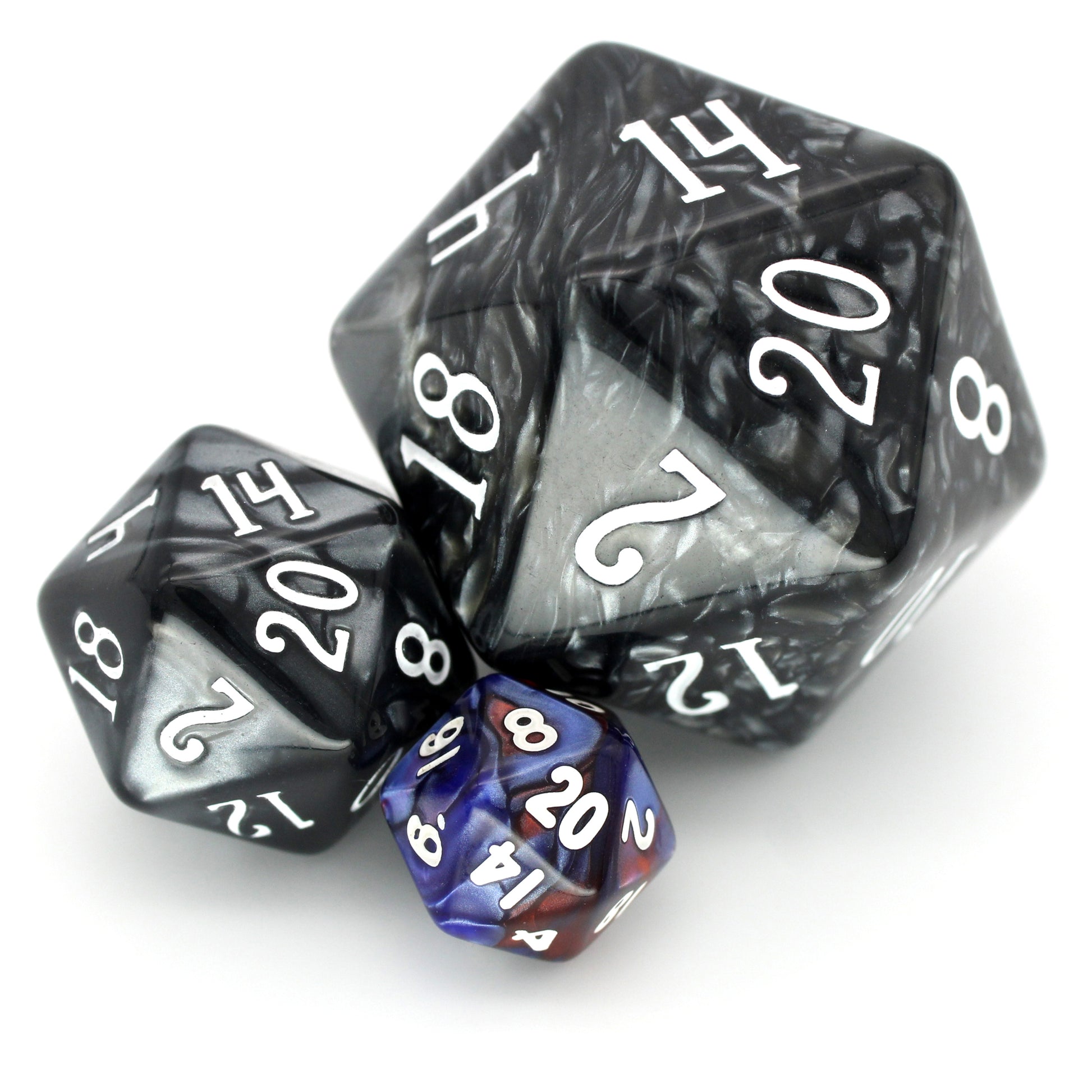 D'stracting is a 7-piece 13mm resin dice set with swirls of shimmery, pearlescent red and blue, with white ink. It belongs to our tiny but mighty Wee Lads collection.