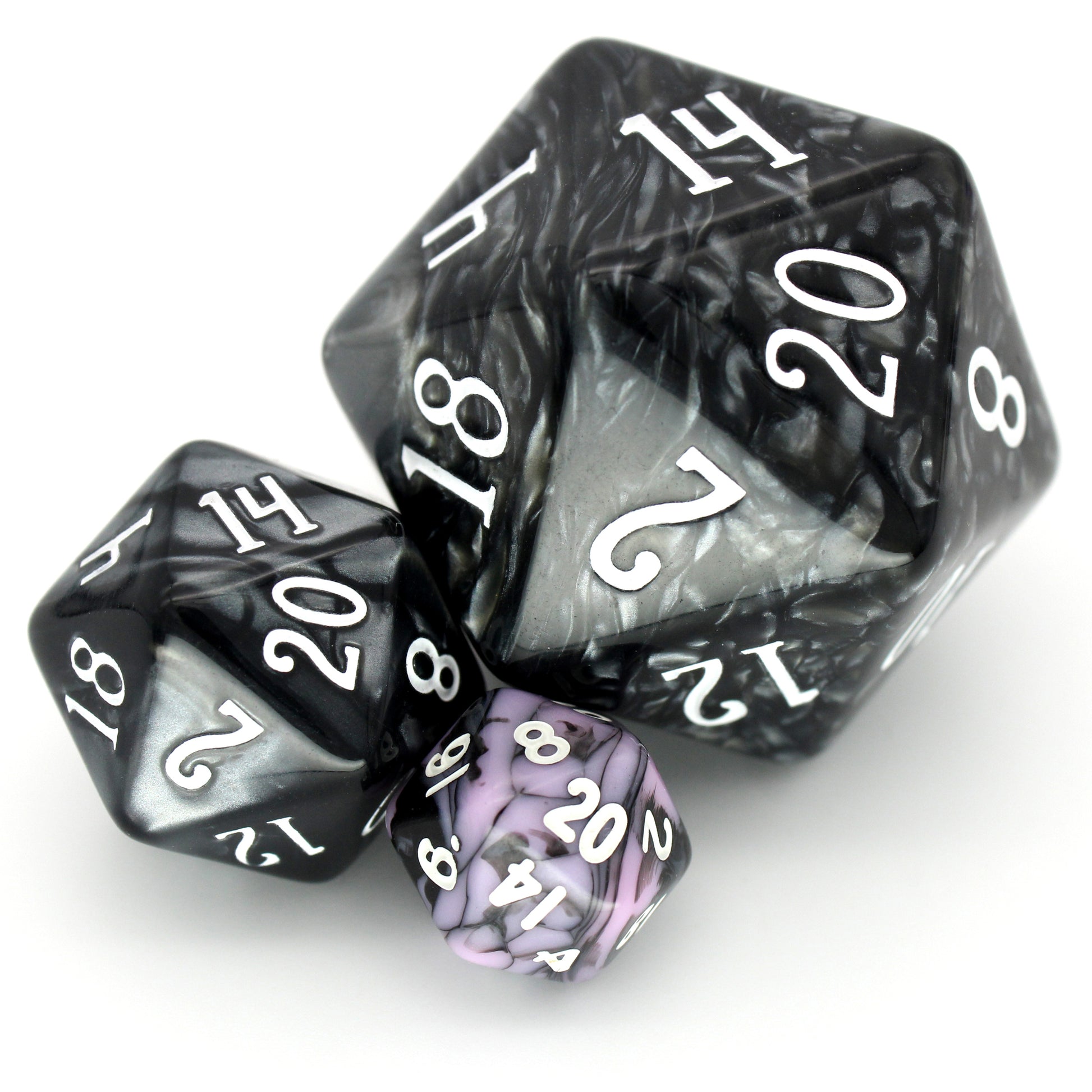 D'vas is a 7-piece 13mm resin dice set with swirls of black and pink, inked in white. It belongs to our tiny but mighty Wee Lads collection.