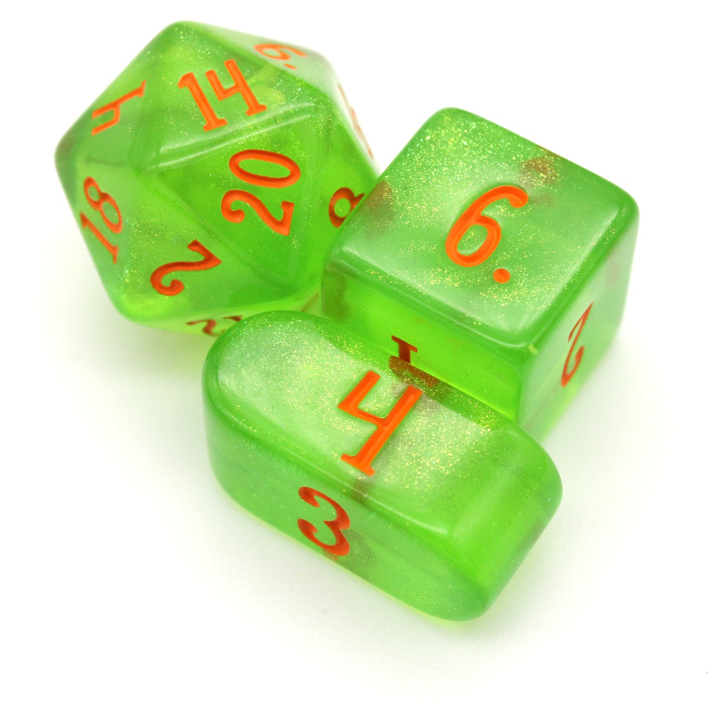 A 10-piece set of transparent green dice filled with micro glitter and inked in orange.