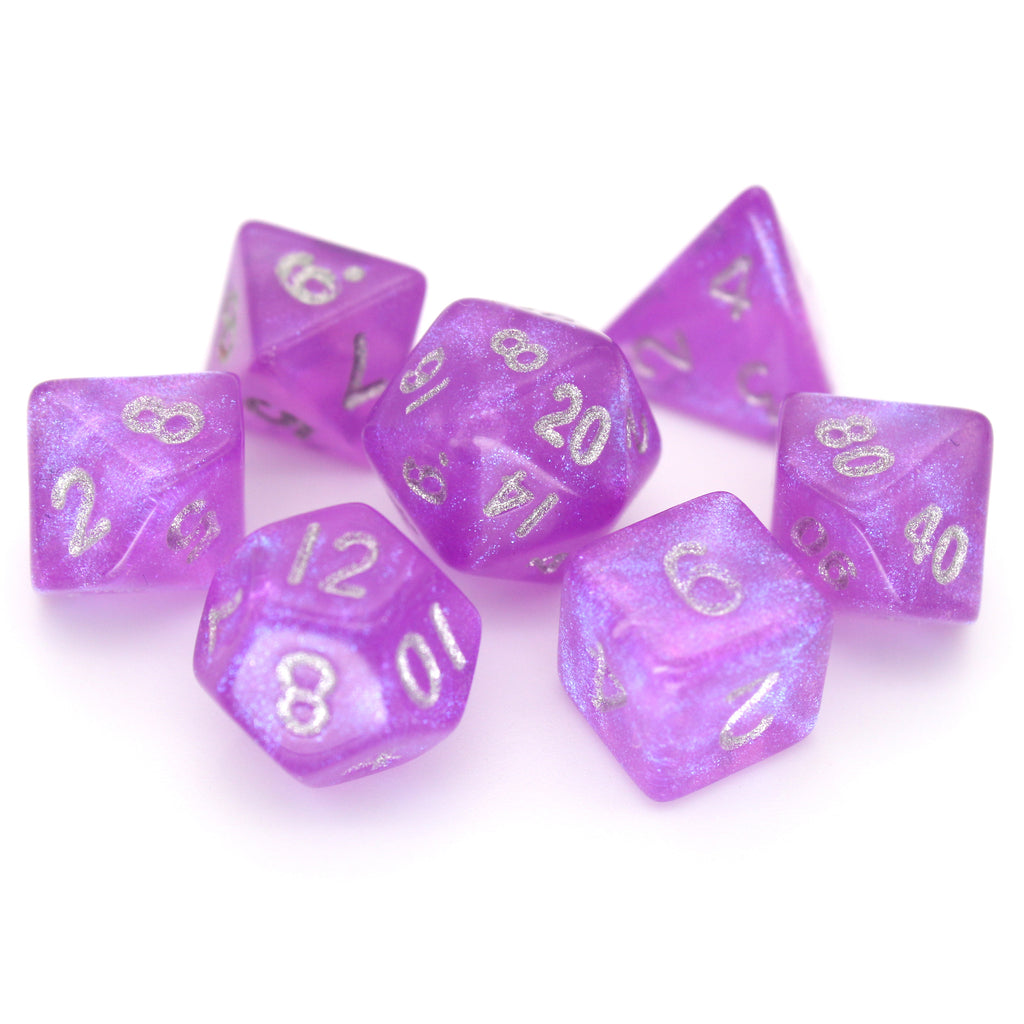 Fuchsia Past is a 7-piece 13mm semi-translucent glittery fuchsia resin dice set, inked in silver. It belongs to our tiny but mighty Wee Lads collection.