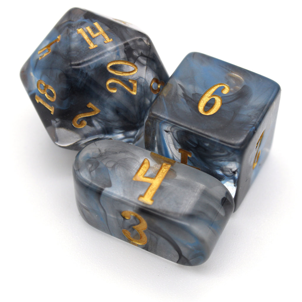 Nyx’s Embrace is a 10-piece set with blue and black vapor suspended in clear resin and inked in gold for easy readability.