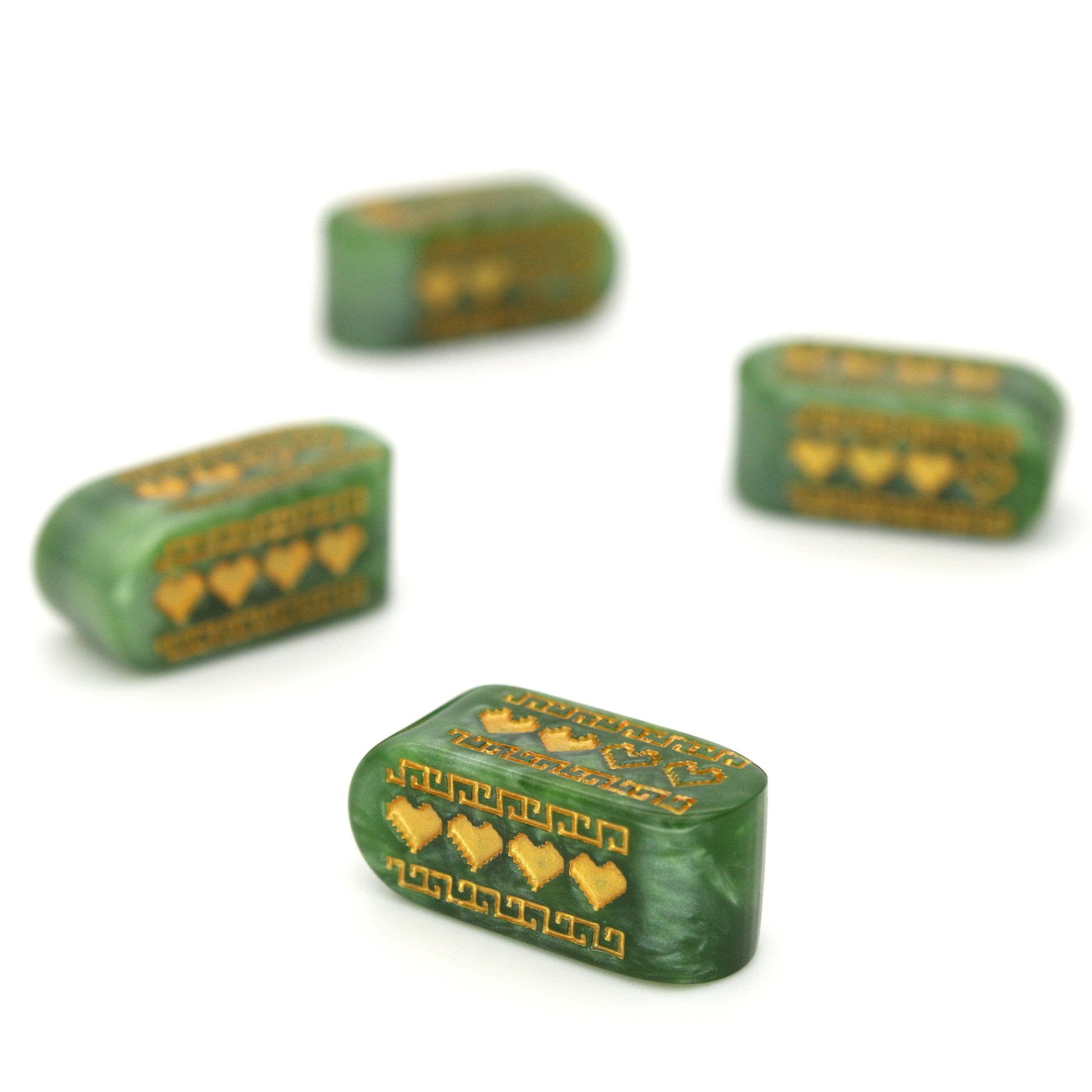 Pixel Hearts: Hylian are custom marbled green resin Infinity d4s inked in gold.