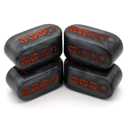 Pixel Skulls: Pumpkin Goth are custom black resin Infinity d4s inked in Halloween orange.