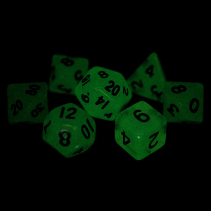 Raindrops is a 7-piece 13mm semi-opaque grey resin dice set, inked in black. They glow green in the dark and belong to our tiny but mighty Wee Lads collection.