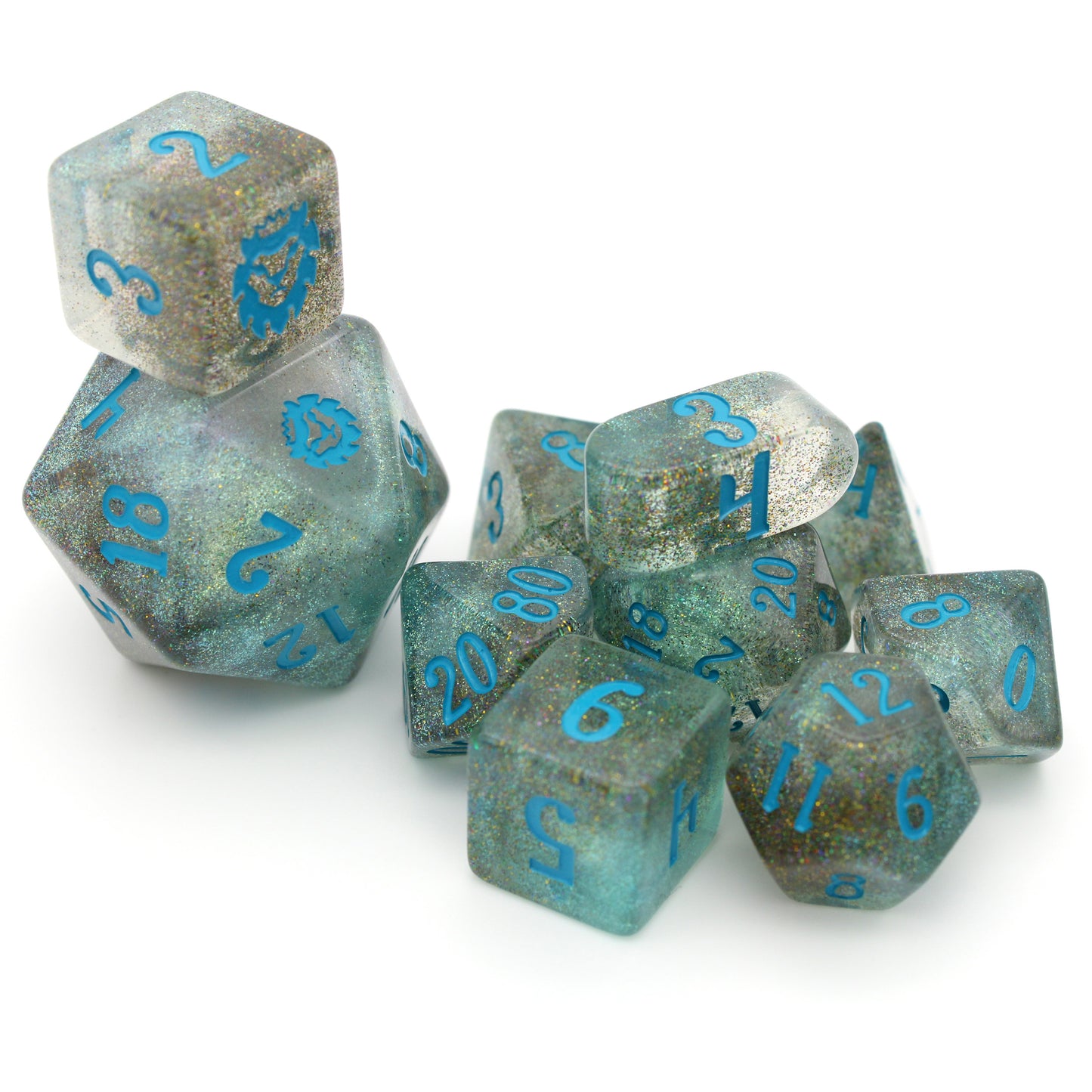 River Magic is a 10-piece dice set of swirling blue, brown, and clear resin, shot through with silver glitter and inked in teal.