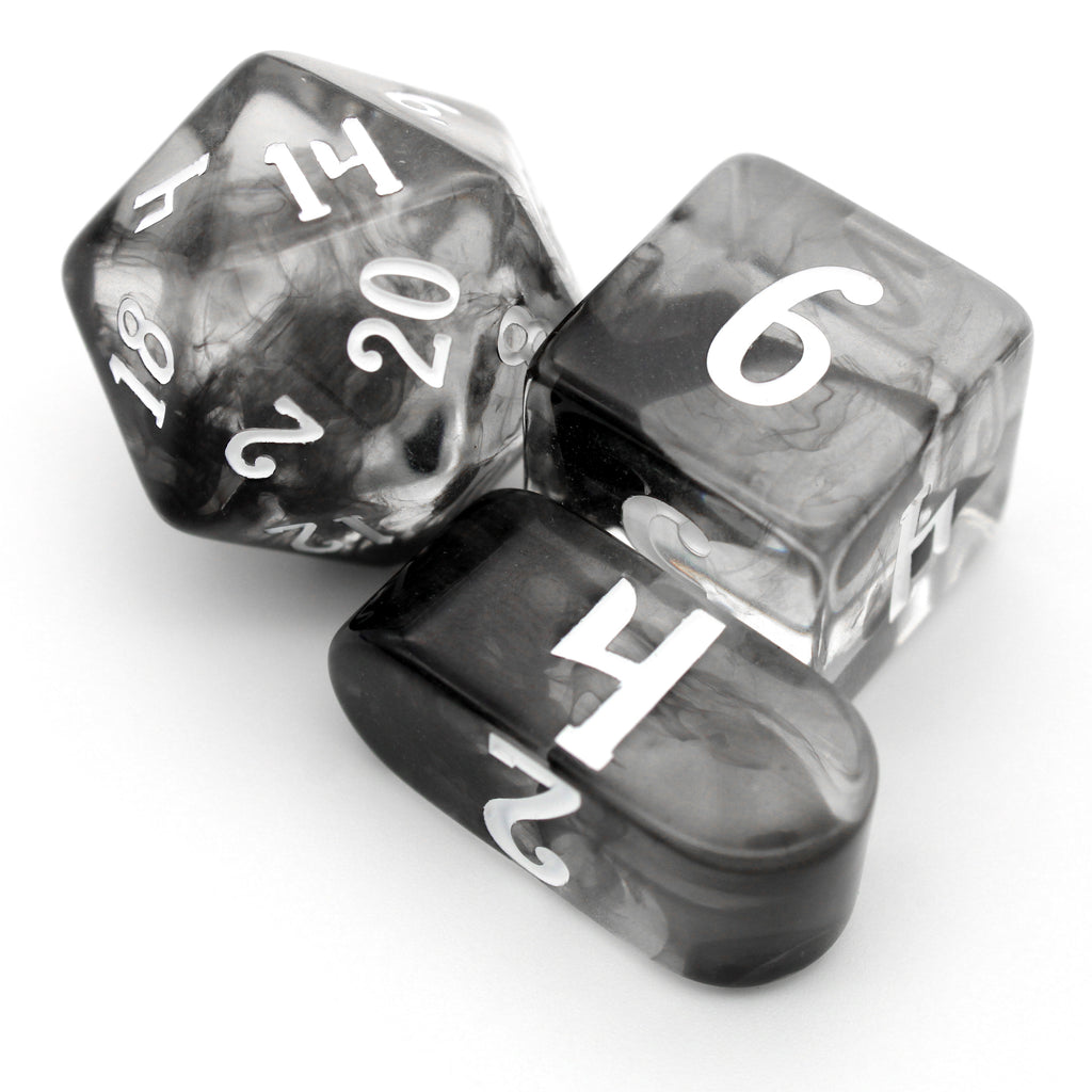 Sicarius is a 10-piece crystal clear resin dice set swirled with magical black vapor and inked in white, perfect for any player who knows DEX is the most important stat.