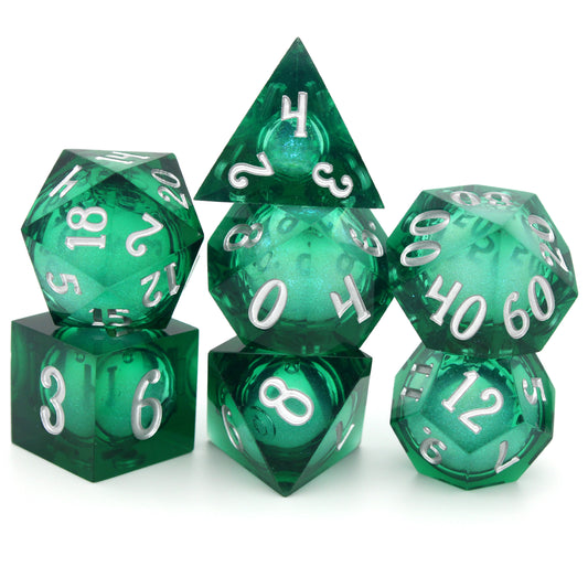 Siren Song is a 7-piece, translucent emerald-green, sharp edge resin dice set with a liquid core of color-shifting pearlescent glitter, inked in silver.