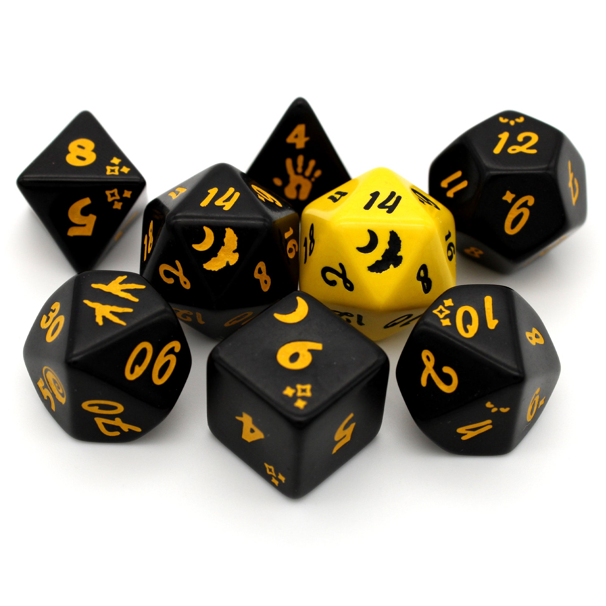 Strigidae is an 8-piece engraved acrylic set in witching black with owl transformation icons inked in penetrating golden yellow. Included is an alternate d20 in reverse colors.