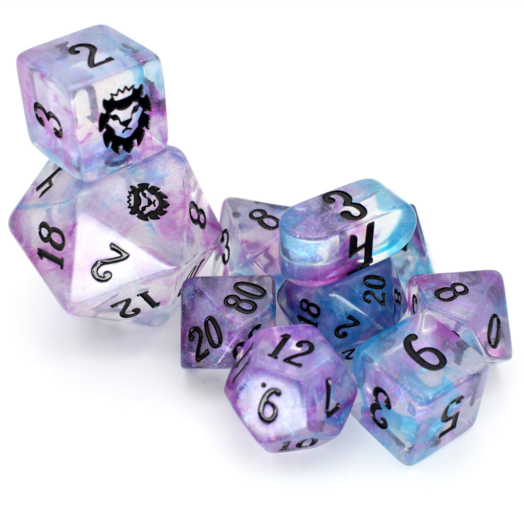 Will-O-Wisp is a 10-piece clear resin dice set with iridescent microglitter and rare pearlescent wisps of blue and purple swirls.