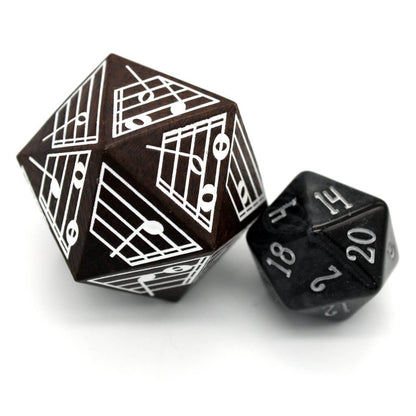 Ebony d20 with music notes and regular d20